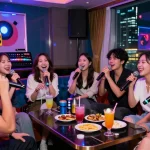 Enjoying a fun night at 강남노래방 with friends, vibrant atmosphere and drinks.